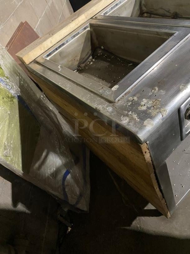 Wells commercial stainless steel 8-well hot food steam table with individual controls, single undershelf, on legs, used condition.