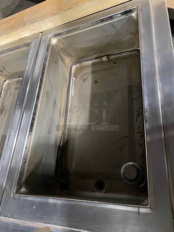 Wells stainless steel 8-well electric steamtable with individual controls, single undershelf, on legs, used condition.