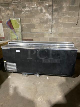 Beverage-Air DW79B commercial black bottle cooler with stainless steel worktop, sliding lid, visible serial number 9805862.