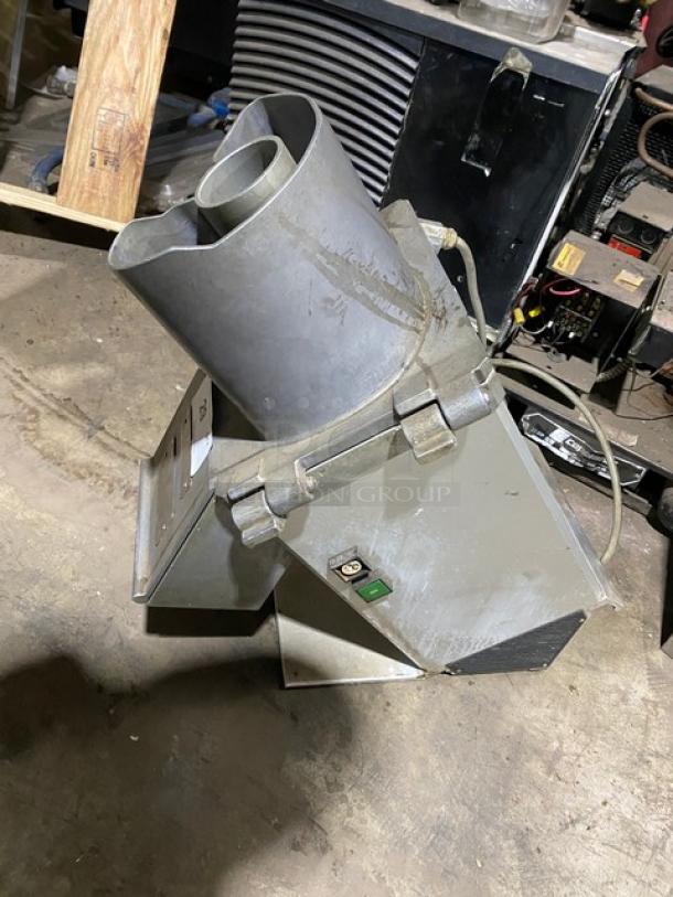 Hobart commercial electric continuous feed food processor, metal body, visible wear, equipped with on/off switch and power cord.