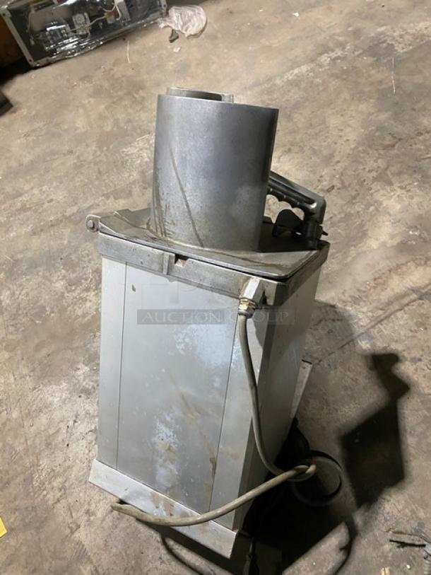 Hobart commercial electric countertop food processor, continuous feed, visible wear, sturdy metal construction.