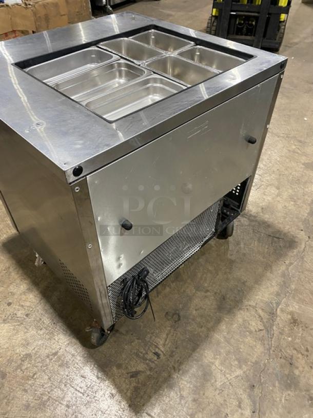 True TSSU-36-12M-B stainless steel 2-door refrigerated prep table with hotel/steamtable pan, on casters. Model 6986854.