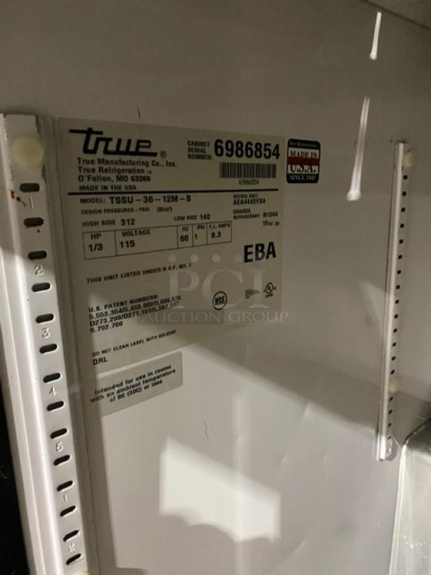 True stainless steel 2-door refrigerated prep table, model TSSU-36-12M-B, with hotel/steamtable pan, on casters, 115V.