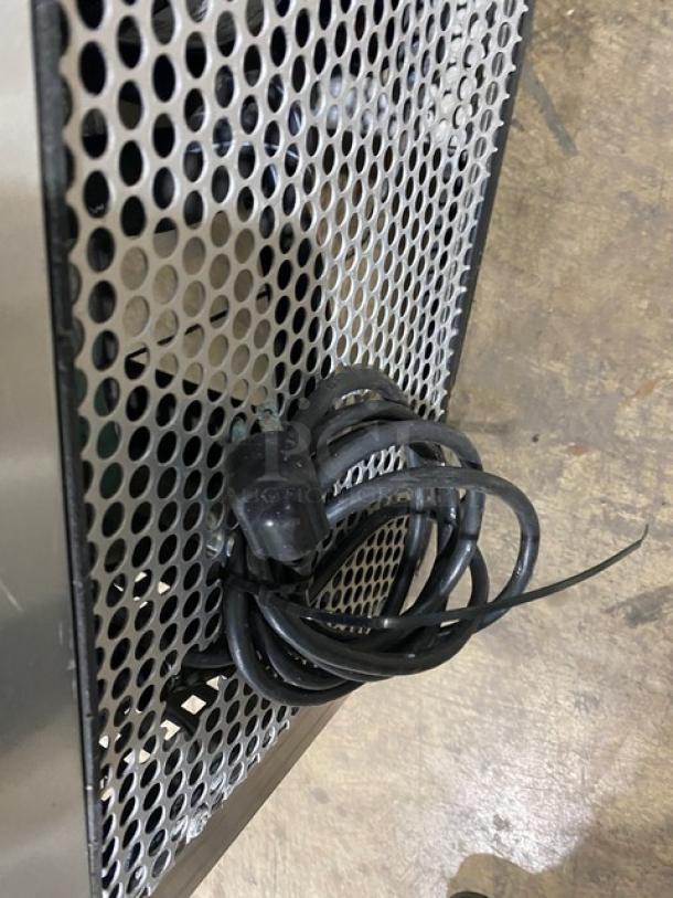 True TSSU-36-12M-B stainless steel 2-door refrigerated prep table with caster wheels, shown with coiled power cord.