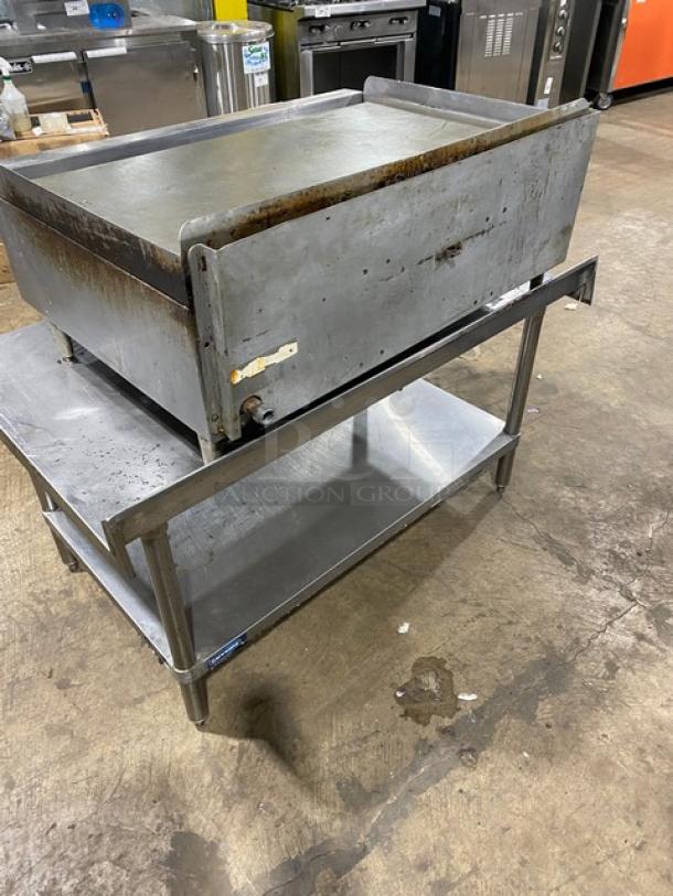 Rankin-Delux GT36C stainless steel 36" flat griddle with thermostatic control, back and side splash, on undershelf worktop table.