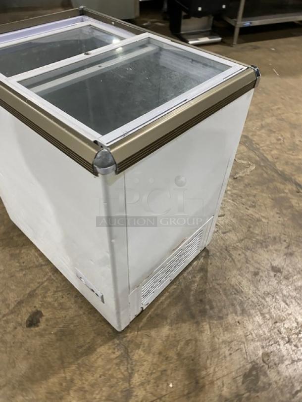 Omcan commercial ice cream display freezer with double glass sliding lid, Model FR-CN-0150, 110V, in good condition.