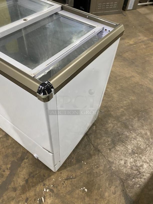 Omcan commercial ice cream display freezer, model FR-CN-0150, with double glass sliding lid, 110V, white, minor wear.