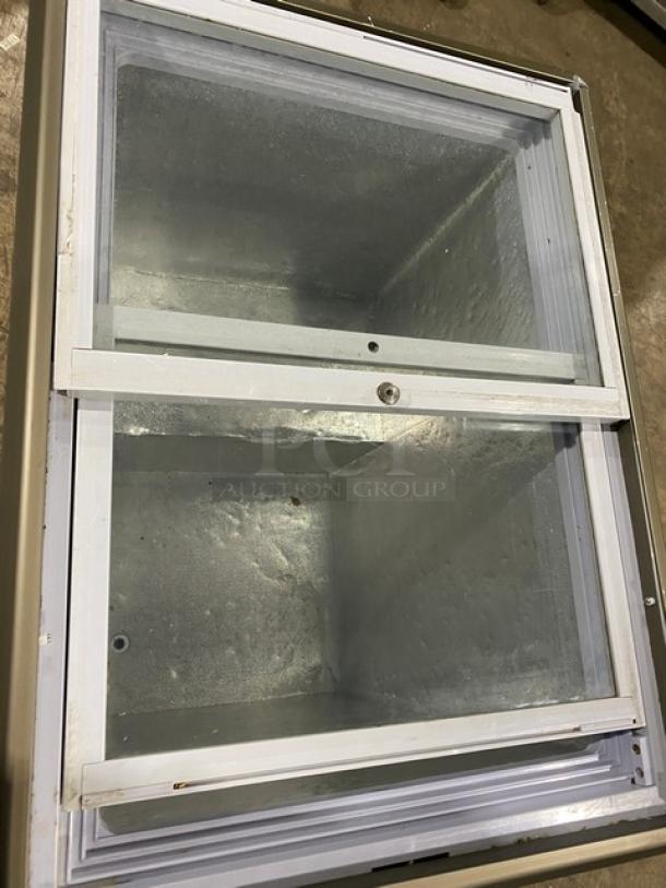 Omcan commercial ice cream merchandiser freezer with double glass sliding lid, Model FRCN0150, 110V, in good condition.