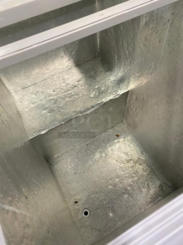 Omcan FR-CN-0150 ice cream merchandiser interior, clean condition, metal finish, suitable for commercial use.