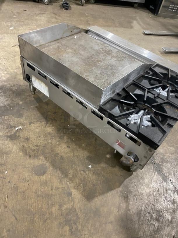 Comstock-Castle FHP3624 stainless steel 2-burner countertop griddle range with flat griddle, back and side splash, on legs.