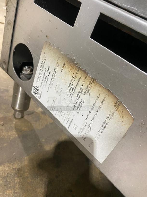 Comstock-Castle stainless steel 2-burner split top griddle range, Model FHP3624, with back and side splash, on legs. Serial Number: 8J668.