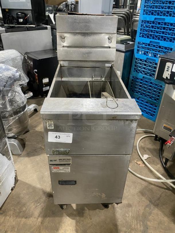Pitco VF35 commercial stainless steel natural gas deep fat fryer with back splash, basket hanger, and fry basket on casters.
