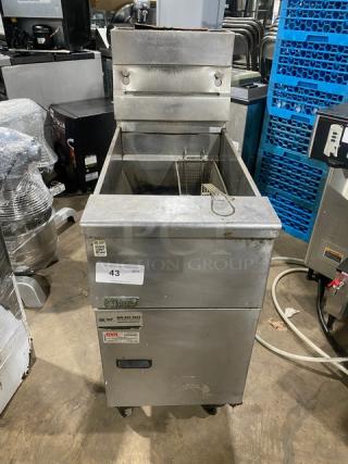 Pitco VF35 commercial stainless steel natural gas deep fat fryer with back splash, basket hanger, and fry basket on casters.