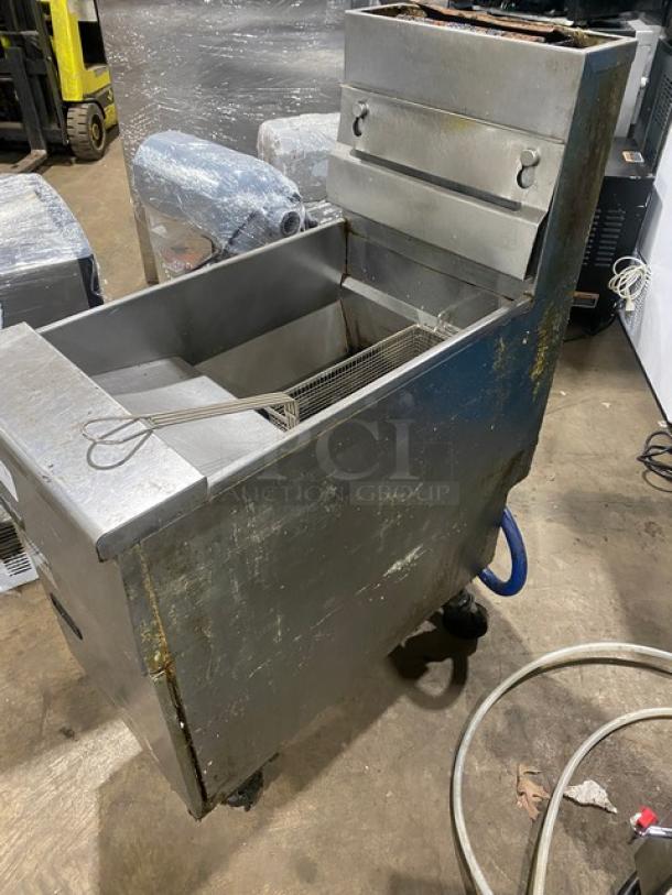 Pitco VF35 commercial fryer, stainless steel, natural gas, 35 lb capacity, with backsplash, basket hanger, and fry basket, on casters.