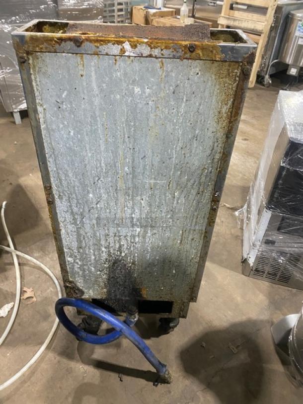 Pitco VF35 commercial stainless steel natural gas fryer, 35 lb capacity, with splash guard and basket hanger, on casters.