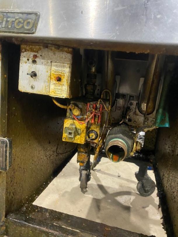 Pitco VF35 deep fat fryer with visible wiring and components. Stainless steel, on casters, includes back splash and basket hanger. Model: VF35.