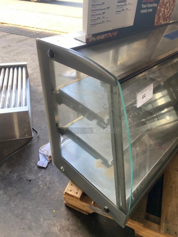 Vendo commercial stainless steel hot food merchandiser with slanted glass, multi-tier shelves, rear sliding doors, 115V.