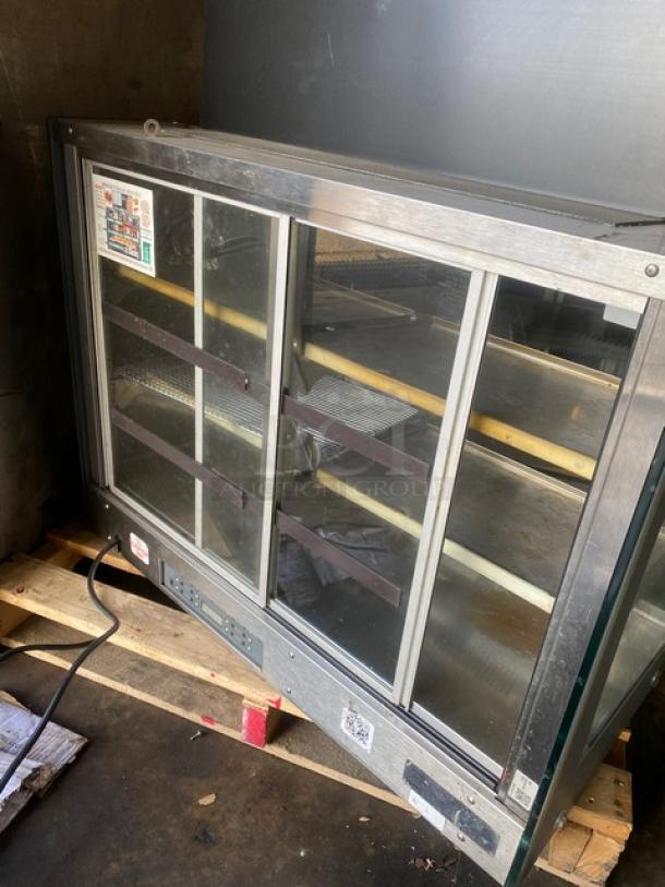 Vendo commercial stainless steel hot food merchandiser with slanted glass, electric-powered, multi-tier, rear sliding doors, 115V.