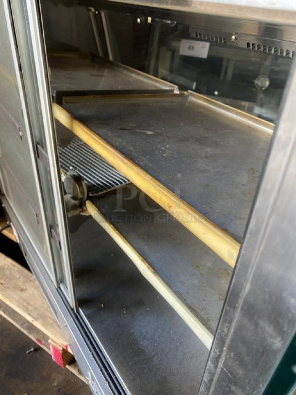Vendo stainless steel slanted glass countertop heated food display, multi-tier, used, with rear sliding doors, 115V.