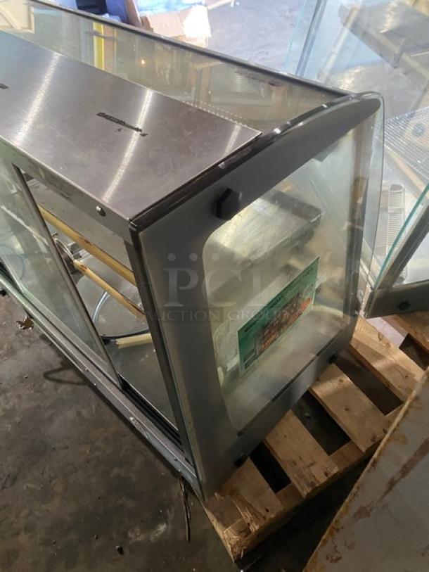 Vendo stainless steel countertop heated food display with slanted glass and rear sliding doors, 115V, used.
