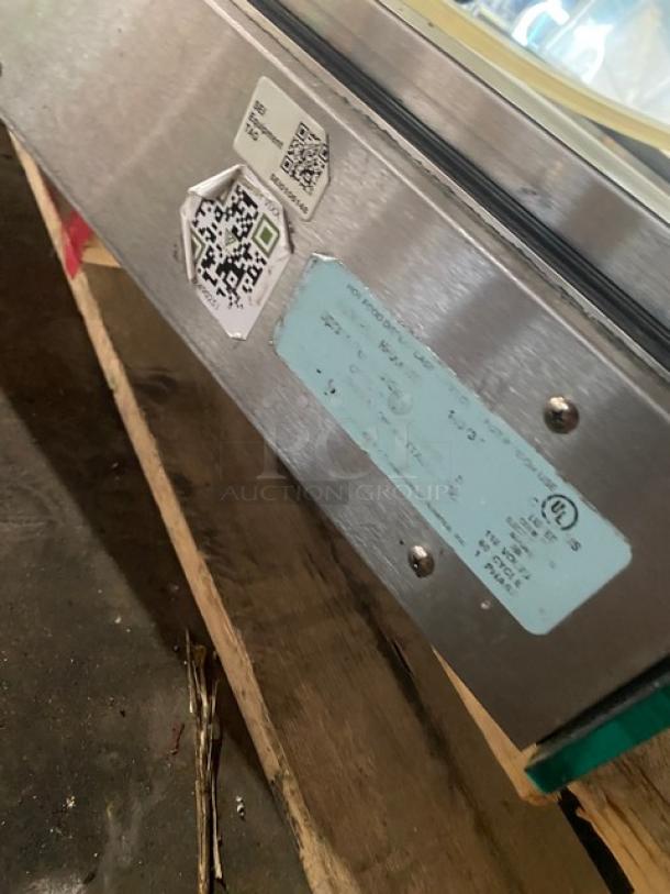 Vendo stainless steel countertop heated display case, slanted glass, rear sliding doors, 115V, commercial use, label visible.