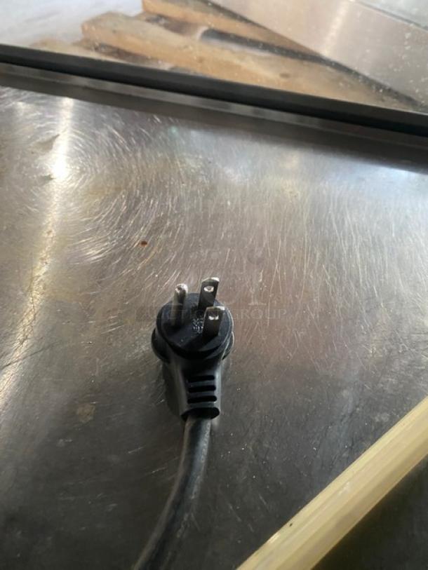 Vendo stainless steel countertop heated food merchandiser with slanted glass and rear sliding doors. 115V, 1 phase.