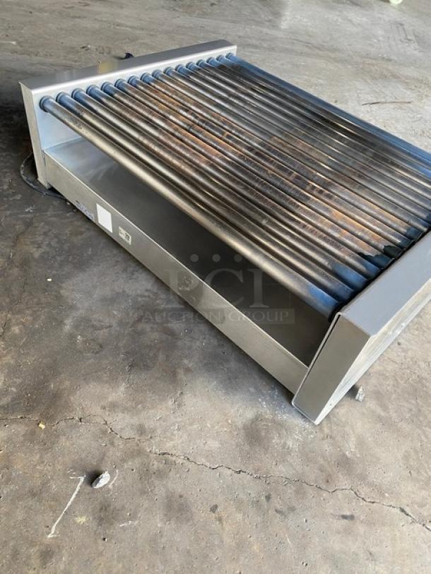 Nemco 8075SX-208-SP stainless steel hot dog roller grill, 75-dog capacity, non-stick rollers, 208V, on legs, used condition.