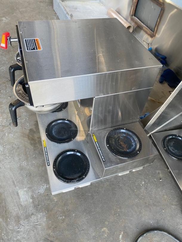 Bunn AXIOM Series commercial twin coffee brewer, stainless steel, with 6 warming plates, hot water dispenser, and brew basket.