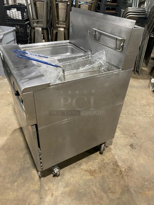 Fry Master FMP145ESC stainless steel 2-bay deep fryer with backsplash, basket hanger, and filtration system. On casters.