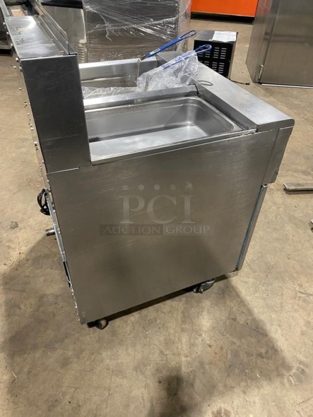 Fry Master FMP145ESC stainless steel 2-bay deep fryer, natural gas, filtration system, baskets, casters, excellent condition.