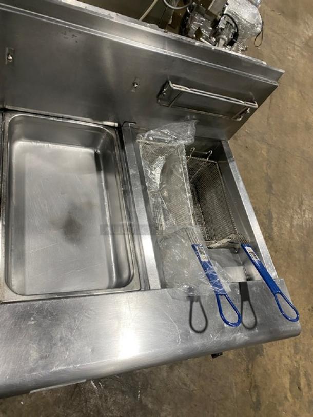 Fry Master FMP145ESC commercial deep fat fryer, stainless steel, 2 bays, filtration system, basket hanger, on casters.