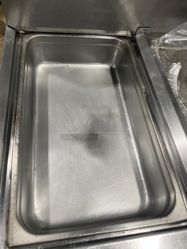 Fry Master FMP145ESC commercial stainless steel 2-bay deep fat fryer with basket hanger, filtration system, and casters.