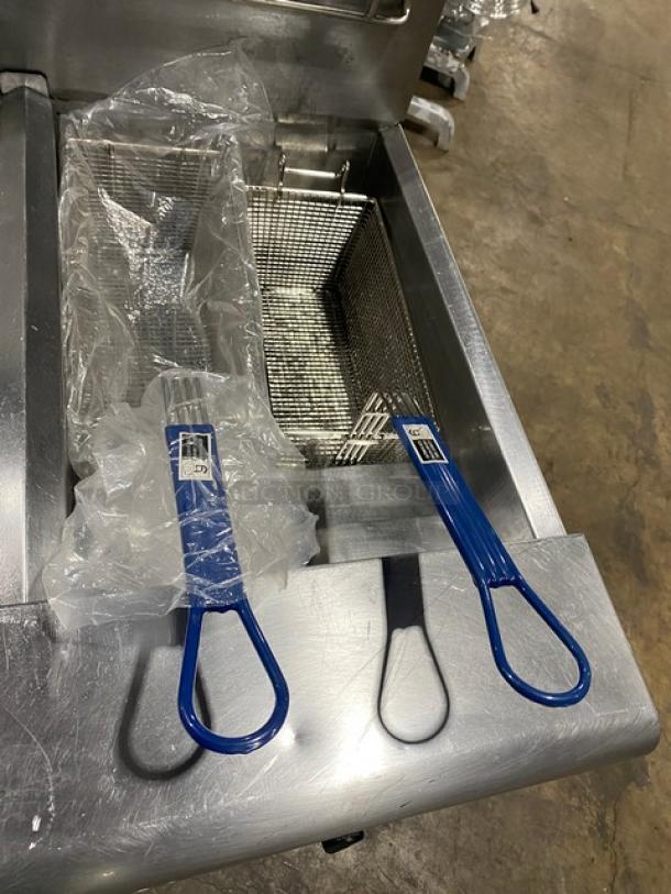 Fry Master FMP145ESC 2-bay stainless steel deep fryer with blue-handled baskets, backsplash, and filtration system on casters.