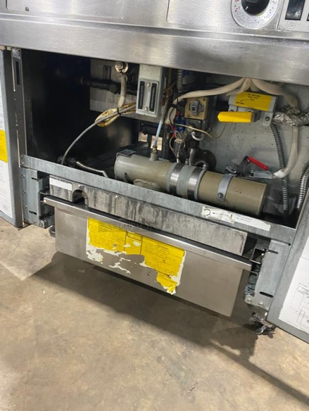 Fry Master FMP145ESC commercial fryer, 2 bay, stainless steel, natural gas, with backsplash, basket hanger, filtration system, on casters.