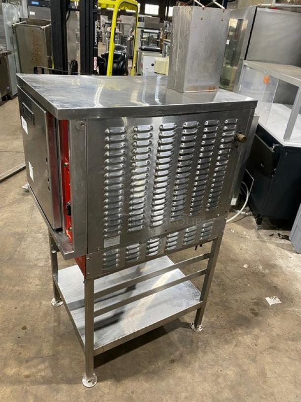 Vulcan commercial stainless steel gas convection steamer with single undershelf pan-holding stand on legs. Appears in good condition.