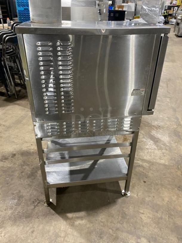 Vulcan commercial stainless steel gas-powered convection steamer with undershelf pan-holding equipment stand on legs.