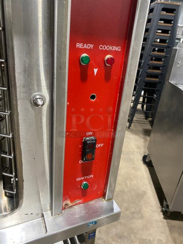 Vulcan commercial stainless steel convection steamer control panel, red and silver with ready/cooking indicators and ignition switch.