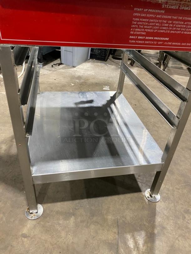 Vulcan commercial stainless steel gas convection steamer with undershelf pan-holding equipment stand on legs, visible red label.