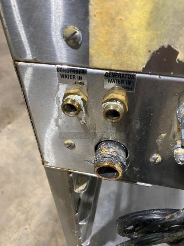 Vulcan stainless steel gas convection steamer; visible water inlet labels; with undershelf equipment stand; good condition.