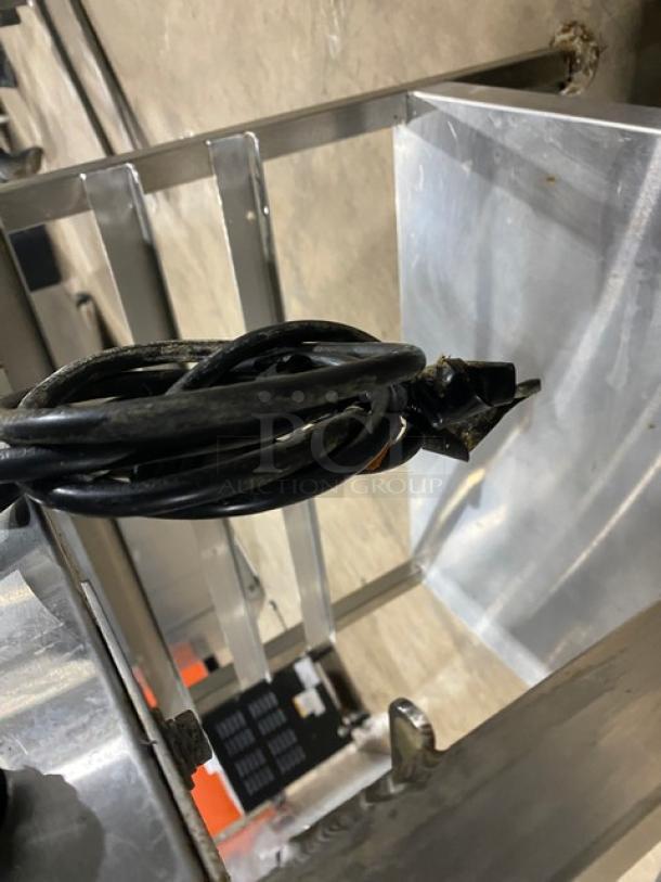 Vulcan stainless steel gas convection steamer with equipment stand; features single undershelf for pan holding, on legs.