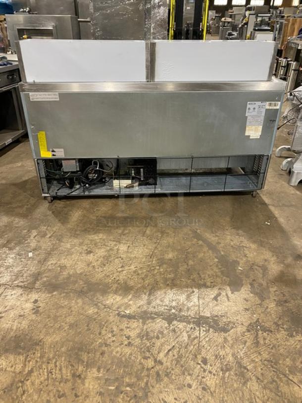 Kool-It Ikon Series 3 Door Refrigerated Bain Marie Mega Top Prep Table, Model KSP72M, with cutting board and wired rack, on casters.