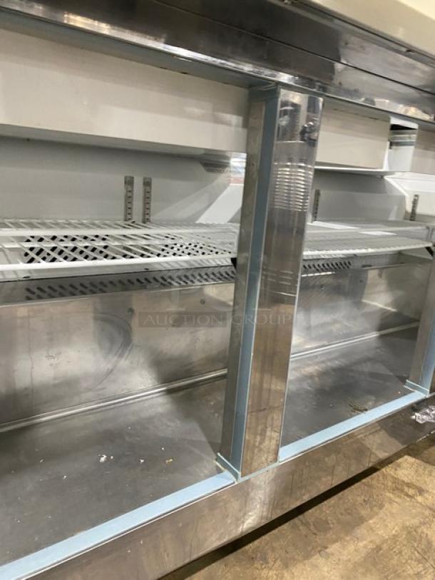 Kool-It KSP72M 3-door refrigerated prep table, stainless steel, bain marie style, cutting board, poly coated rack, on casters.