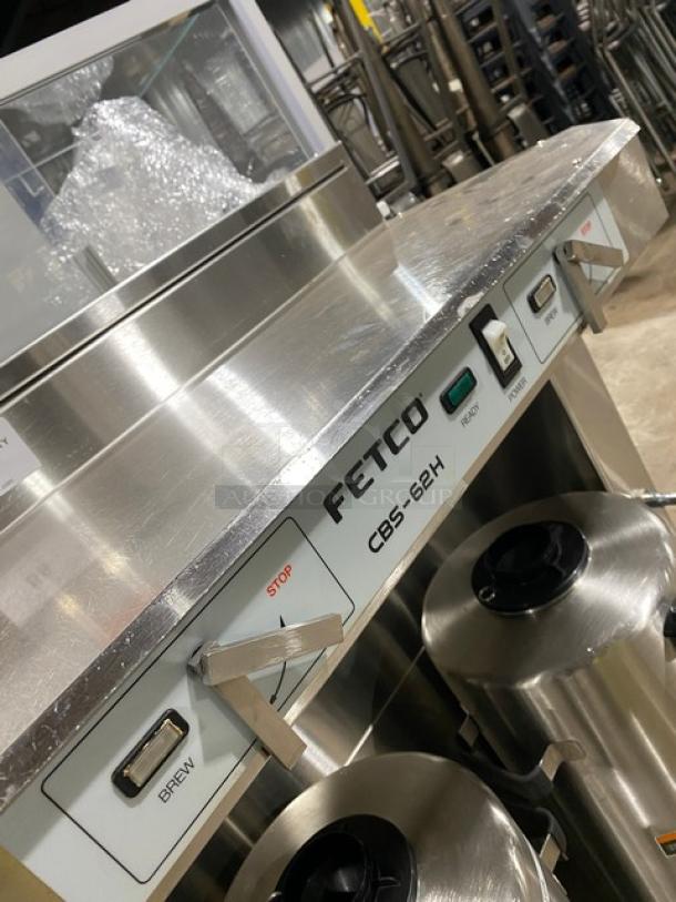 Fetco CBS-62H commercial stainless steel coffee brewer, 2019, automatic, 3-gal capacity, with dispensers, 120/208-240V, on legs.
