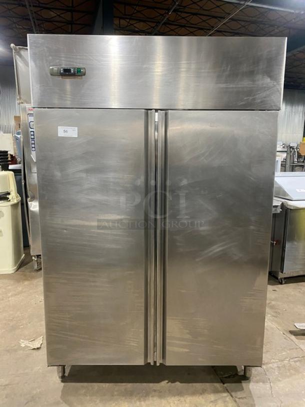 Commercial stainless steel 2-door reach-in refrigerator on legs with poly-coated wire rack, digital controls, excellent condition.