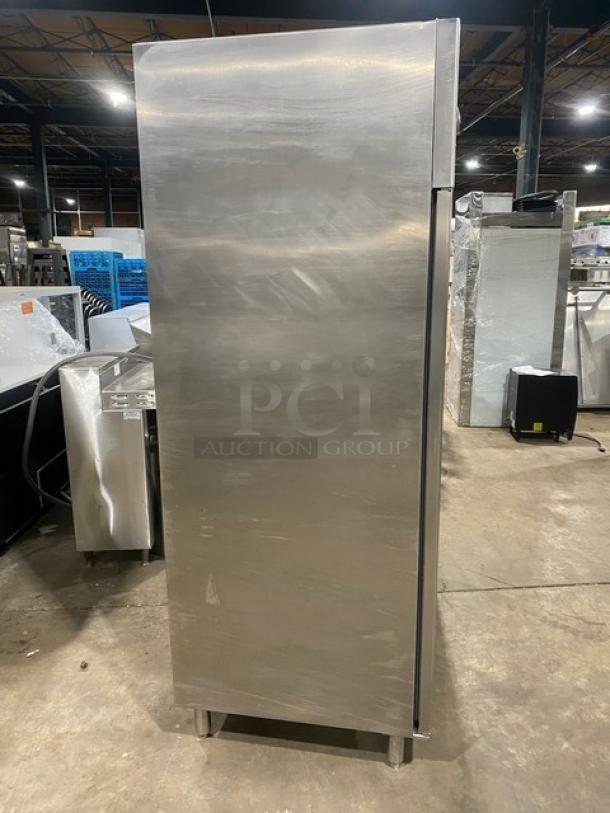 Commercial stainless steel 2-door reach-in refrigerator on legs, featuring poly-coated wired racks, in used condition.