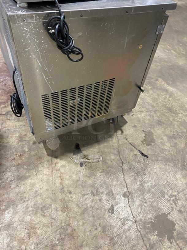 Everest ETR2 stainless steel 2-door undercounter refrigerator on casters, includes poly-coated wired rack, 115V, used.