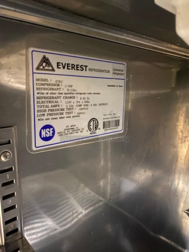 Everest ETR2 stainless steel undercounter refrigerator, labeled with model and specs. Includes poly-coated rack, on casters.