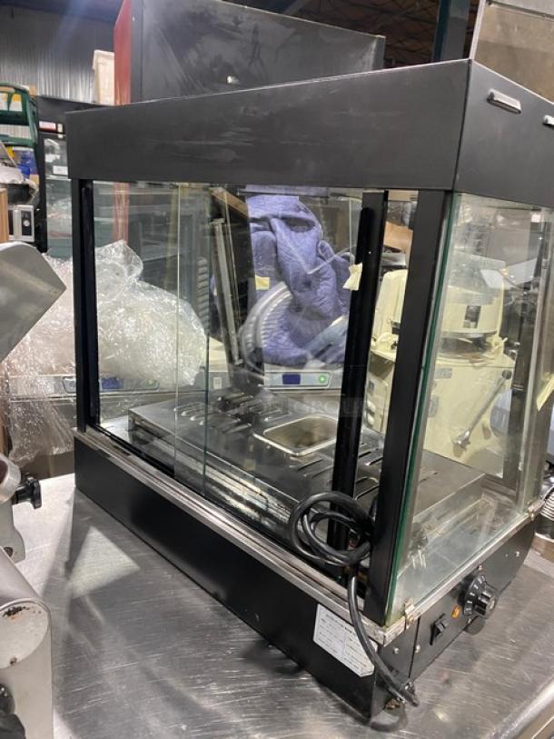 Commercial black slanted glass electric food display case, Model FW-2-2, stainless steel interior, 110V, 1 phase.