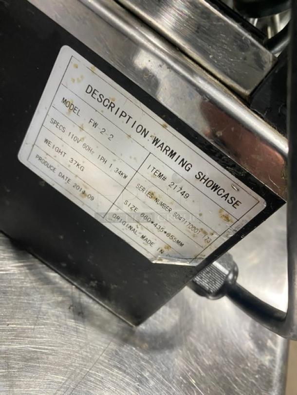 Commercial black slanted glass electric heated food display case, stainless interior, Model FW-2-2, 110V, SN: S047170001-173.