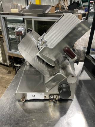 Globe commercial electric deli meat slicer, countertop model with knife feed on legs, stainless steel, good condition, knob controls.